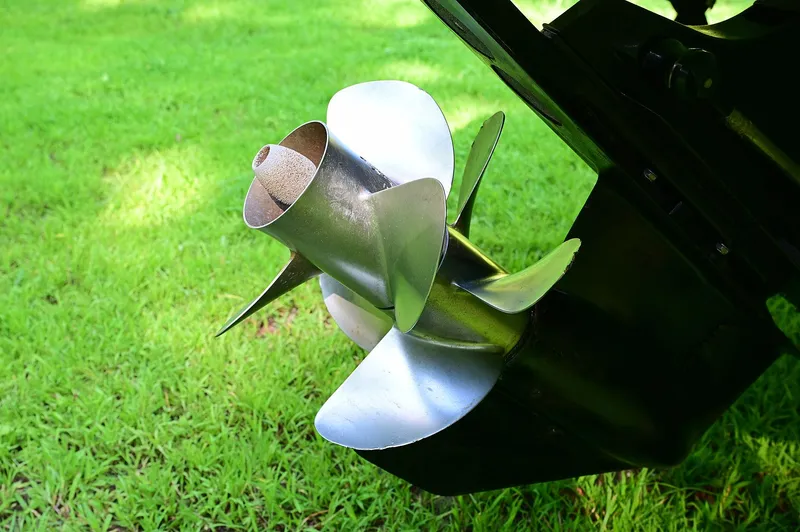 Slide: The Image of Stainless steel boat propeller on a 2015 Crownline 236, displayed on grass. - 28