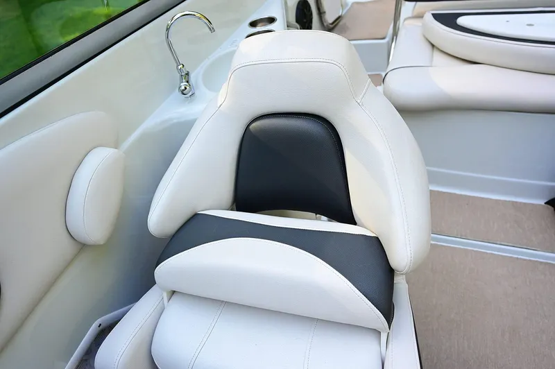 Slide: The Image of Luxurious seating in 2015 Crownline 236 boat with white and black upholstery. - 44