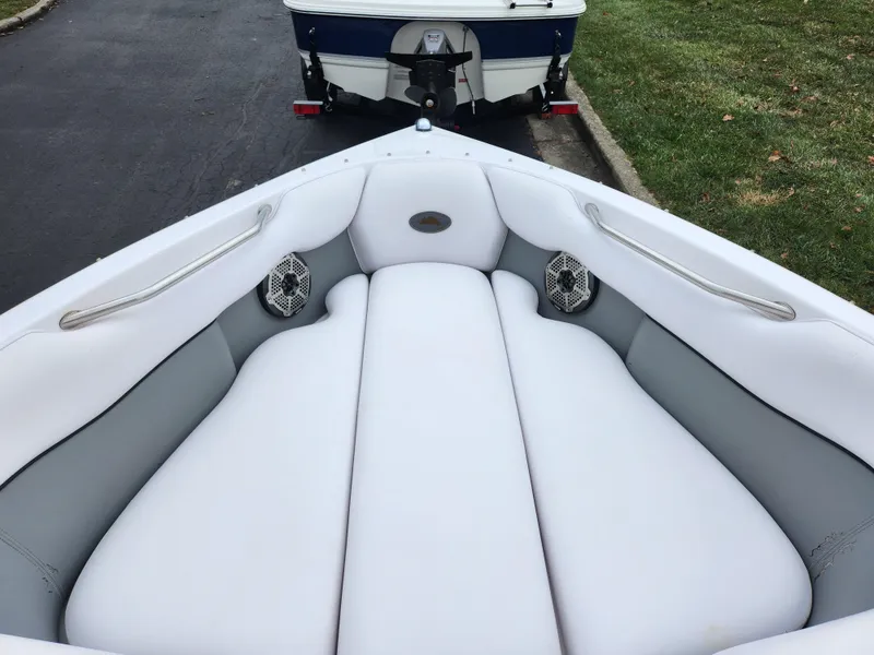 Slide: The Image of 2004 Supra Launch SSV boat interior with white and gray seating. - 14