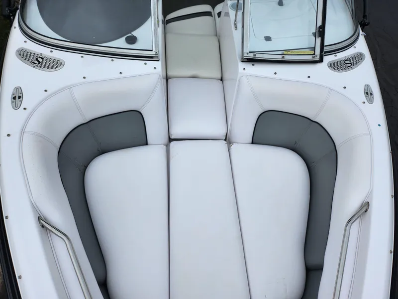 Slide: The Image of 2004 Supra Launch SSV boat interior with white and gray seating. - 15