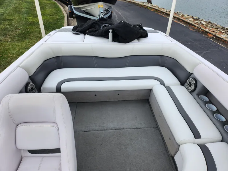 Slide: The Image of 2004 Supra Launch SSV boat interior with white and gray seating. - 17