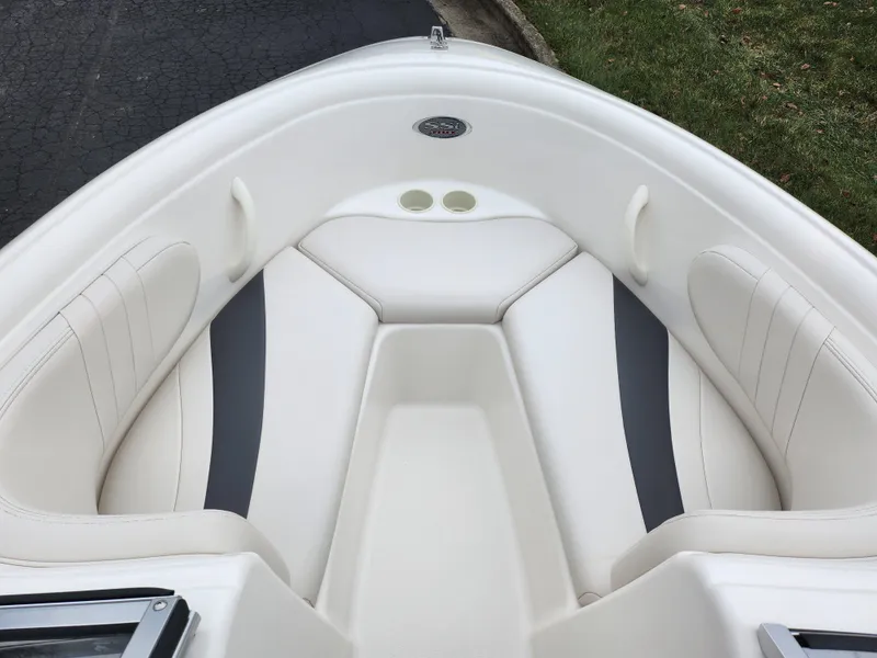 Slide: The Image of 2004 Chaparral 180 SSi boat interior with white and gray seating. - 16