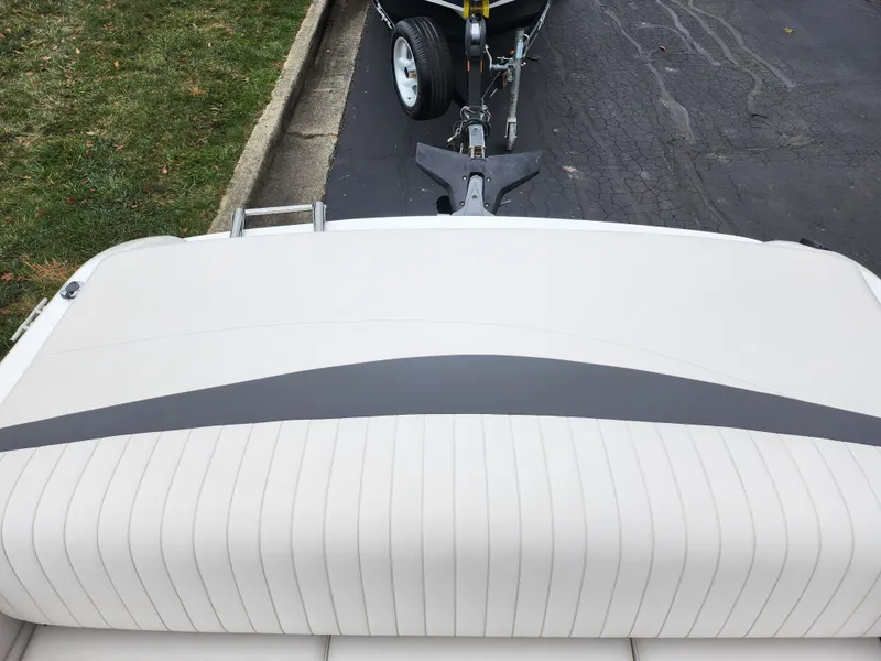 Slide: The Image of 2004 Chaparral 180 SSi boat on trailer, rear view, white and gray upholstery. - 21