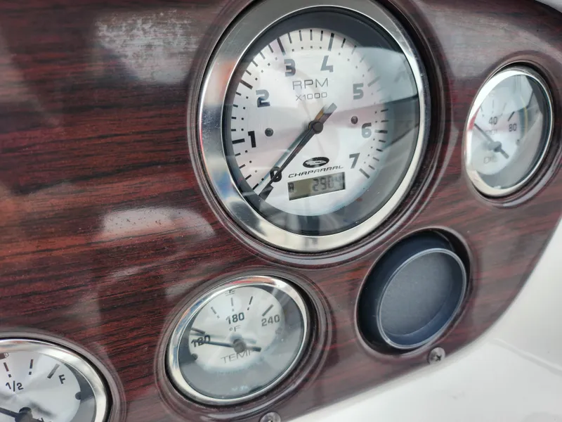 Slide: The Image of Dashboard of 2004 Chaparral 180 SSi boat with RPM and temperature gauges. - 23