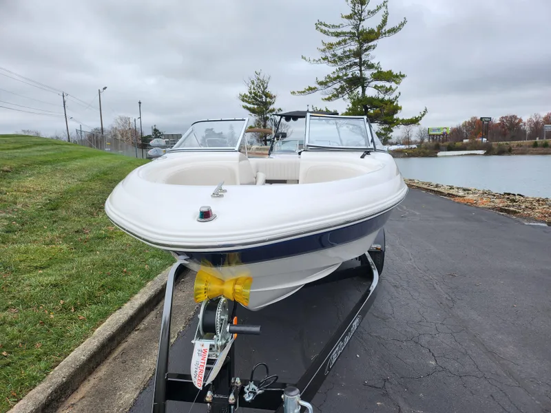 Slide: The Image of 2004 Chaparral 180 SSi boat on trailer near lake, overcast sky. - 6