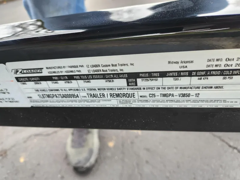 Slide: The Image of Label on EZ Loader trailer, Chaparral 180 SSi, 2004 model, showing specifications and manufacturing details. - 8