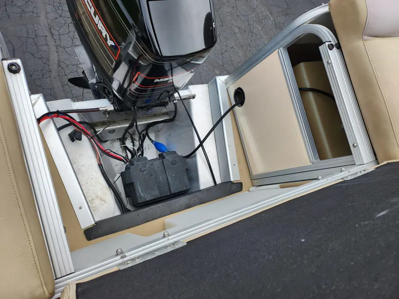 Slide: The Image of Bennington 2580LX boat engine compartment with Mercury motor and battery, 2000 model. - 18