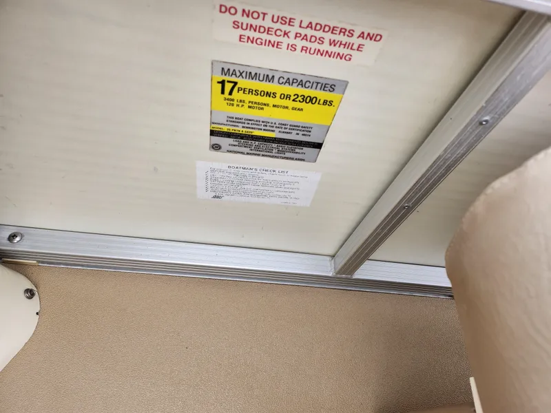 Slide: The Image of Bennington 2580LX 2000 boat capacity label, maximum 17 persons or 2300 lbs. - 22