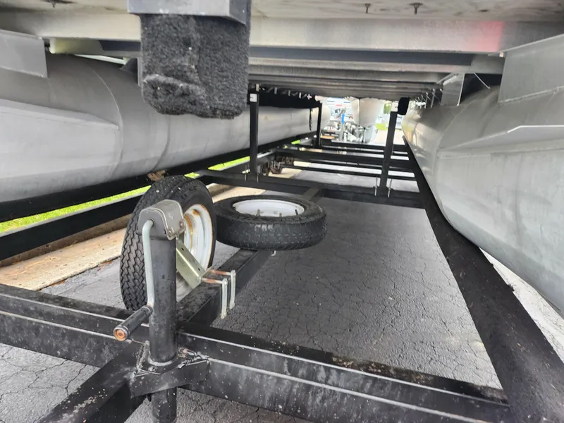 Slide: The Image of Underneath view of a 2000 Bennington 2580LX boat on a trailer. - 7