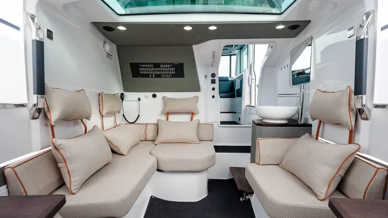 Slide: The Image of Luxurious interior of 2023 Axopar 37 Aft Cabin with plush seating and modern design. - 19