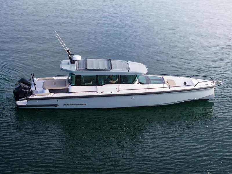 Slide: The Image of 2023 Axopar 37 Aft Cabin boat on calm water, side view. - 3