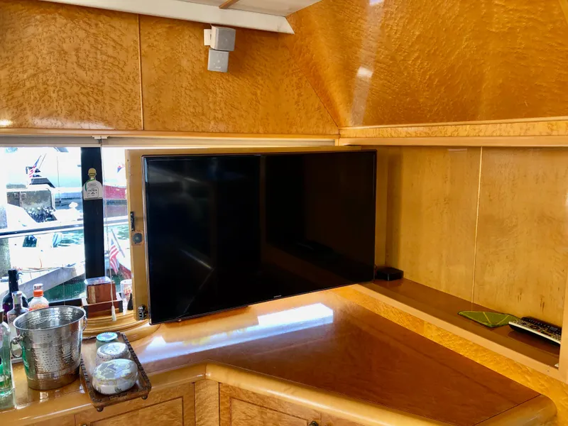 Slide: The Image of TV fold away behind cabinet when not in use. - 19