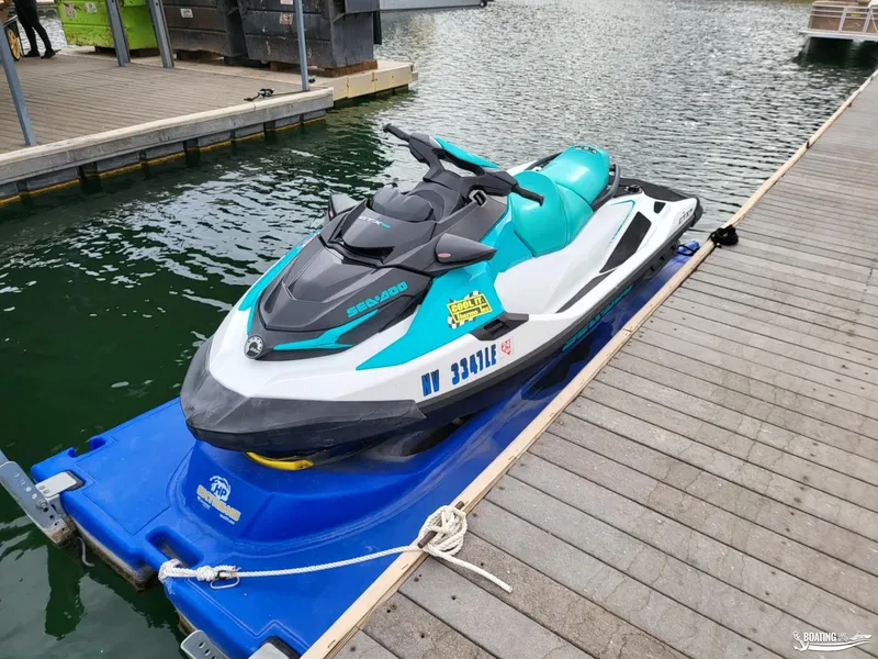 Slide: The Image of 2022 Sea-Doo GTX PRO 130 jet ski docked on a floating platform. - 4