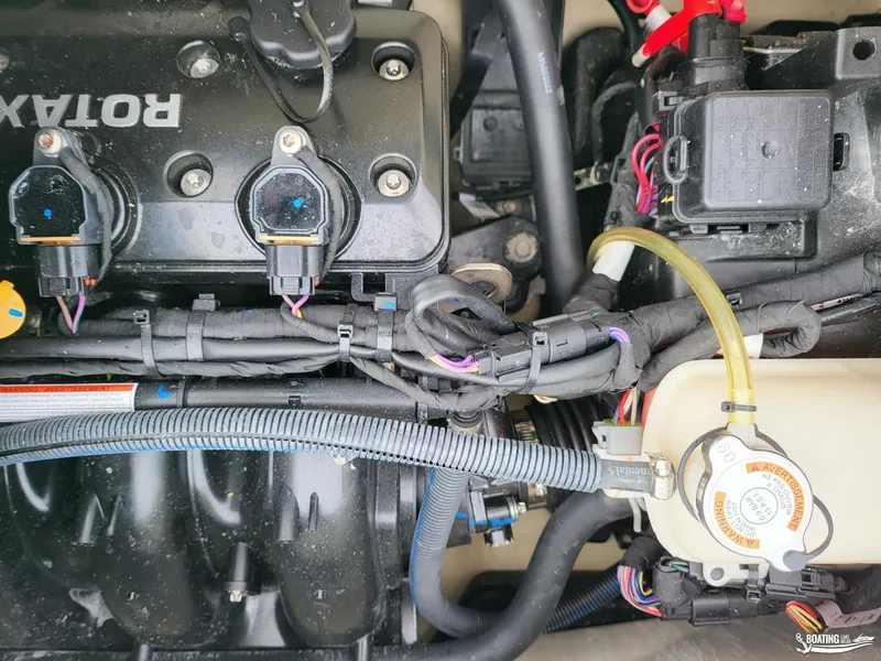 Slide: The Image of 2022 Sea-Doo GTX PRO 130 engine components and wiring close-up. - 7