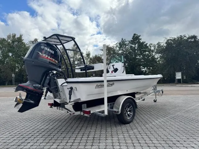 Slide: The Image of 2025 Action Craft 17 Flats boat on trailer with Yamaha outboard motor. - 1