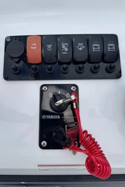 Slide: The Image of Control panel of 2025 Action Craft 17 Flats boat with Yamaha ignition. - 17