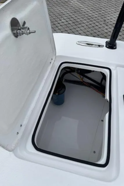 Slide: The Image of Open storage compartment on 2025 Action Craft 17 Flats boat. - 22