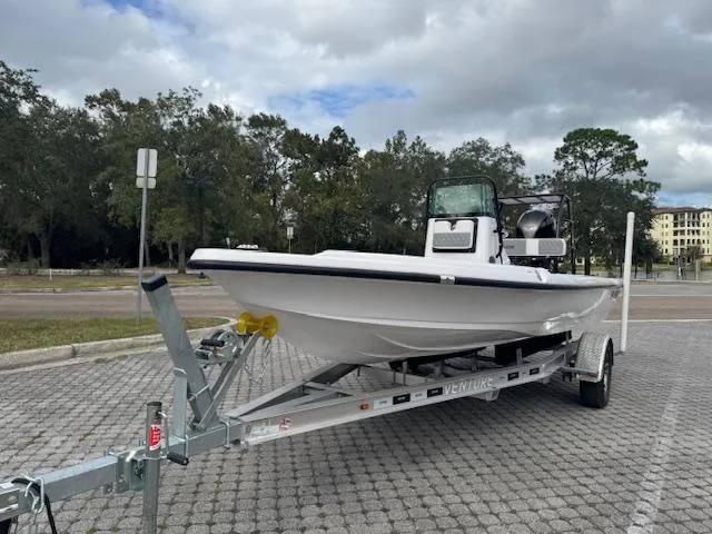 Slide: The Image of 2025 Action Craft 17 Flats boat on trailer in parking lot. - 6