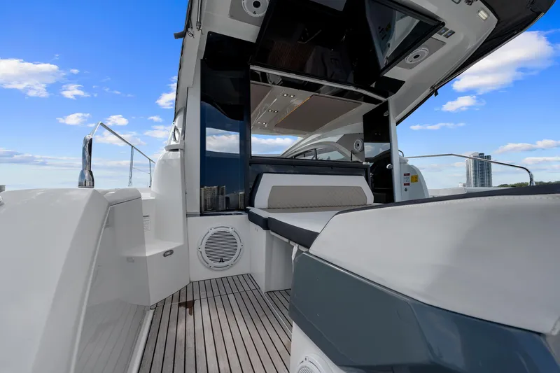Slide: The Image of 2018 Jeanneau Leader 46 yacht deck with modern seating and sleek design. - 16