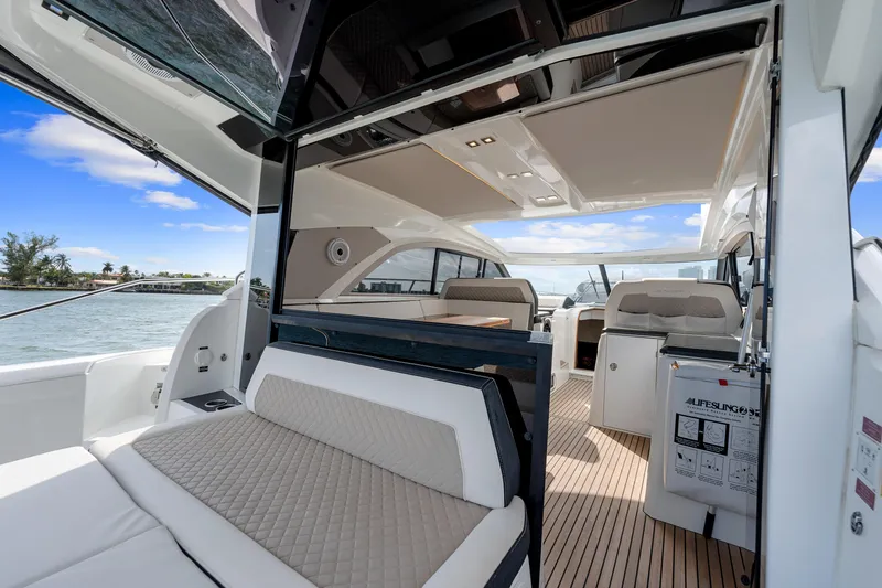 Slide: The Image of Luxurious 2018 Jeanneau Leader 46 yacht interior with elegant seating and open deck view. - 18