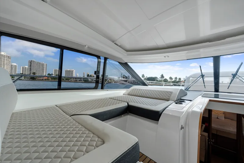 Slide: The Image of Interior of 2018 Jeanneau Leader 46 yacht with luxurious seating and waterfront view. - 22