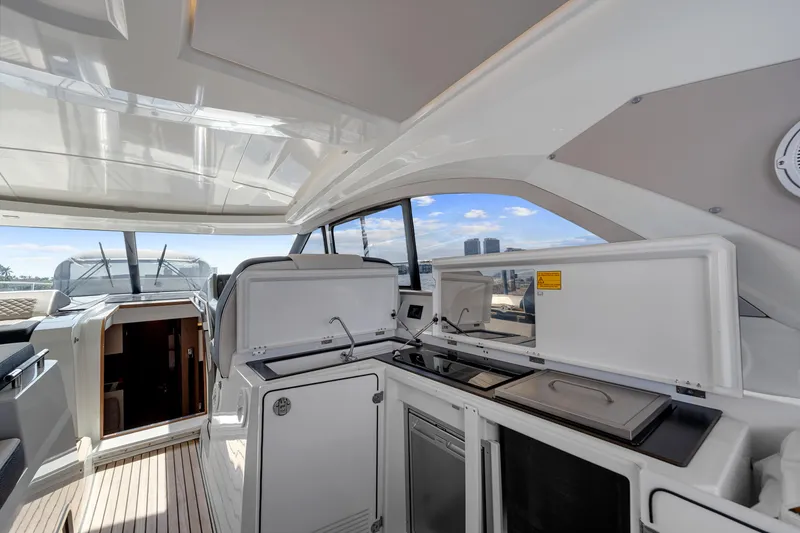 Slide: The Image of 2018 Jeanneau Leader 46 yacht interior with modern kitchen and open deck view. - 29