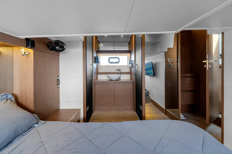 Slide: The Image of Luxurious interior of 2018 Jeanneau Leader 46 yacht, featuring a modern bedroom and bathroom. - 34