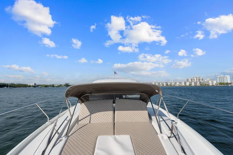Slide: The Image of 2018 Jeanneau Leader 46 yacht on open water under a clear blue sky. - 47