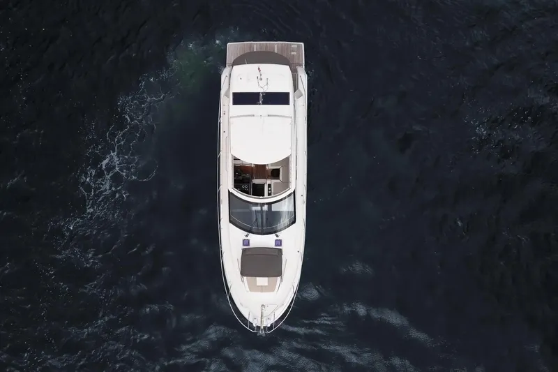 Slide: The Image of Overhead view of 2018 Jeanneau Leader 46 yacht cruising on dark water. - 9