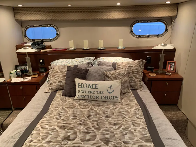 Slide: The Image of 1997 Bayliner Pilothouse boat, sleek white hull, indoor display. - 10