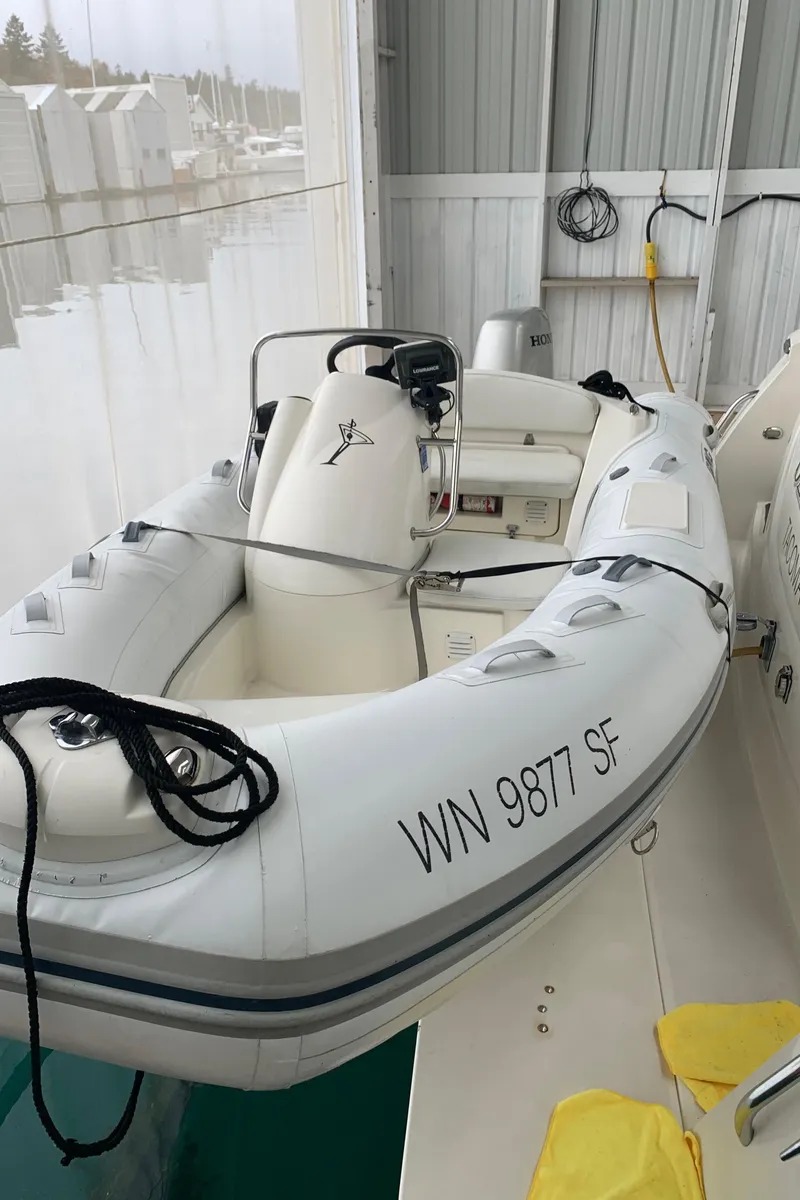 Slide: The Image of 1997 Bayliner 5788 Pilot House Motoryacht interior with seating and covered furniture. - 17