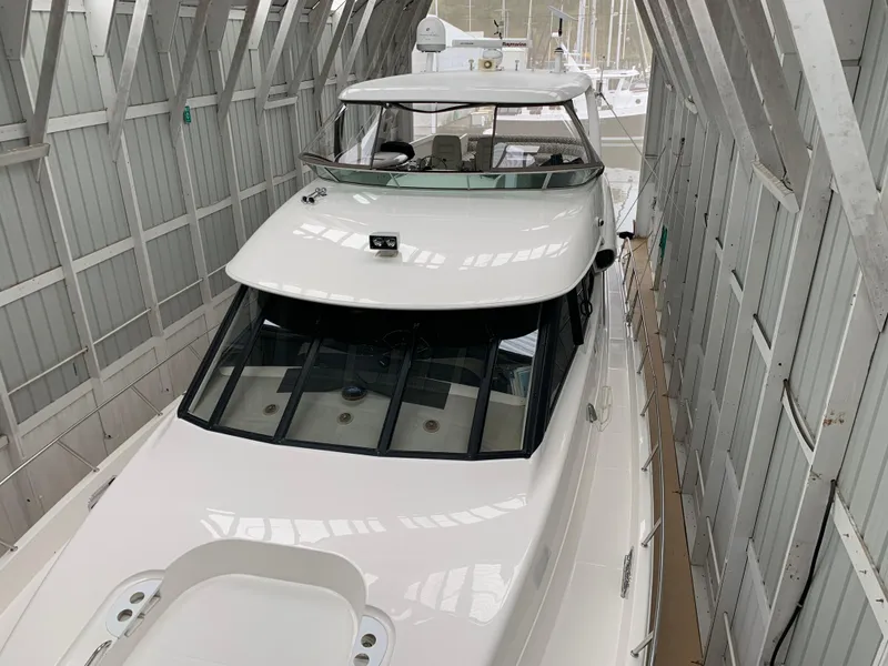 Slide: The Image of Luxurious 1997 Bayliner 5788 Pilot House Motoryacht interior with modern kitchen and seating area. - 2