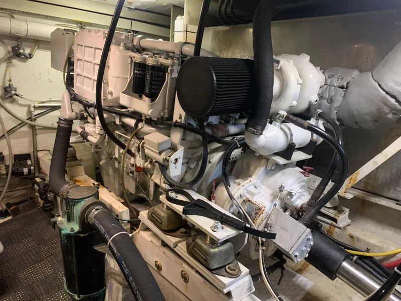 Slide: The Image of 1997 Bayliner 5788 Pilot House Motoryacht interior with helm and covered seating. - 20