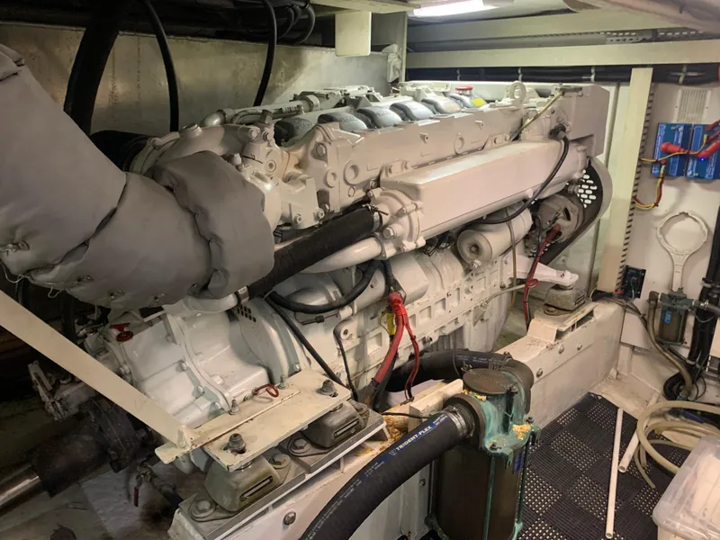 Slide: The Image of Engine room of a 1997 Bayliner Pilothouse with tools and equipment. - 23