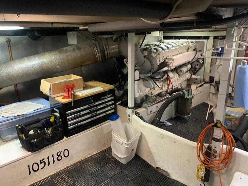 Slide: The Image of Engine room of 1997 Bayliner 5788 Pilot House Motoryacht, showcasing mechanical components. - 25