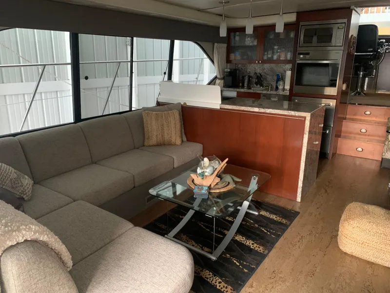 Slide: The Image of Engine room of a 1997 Bayliner Pilothouse boat, showcasing mechanical components and piping. - 27