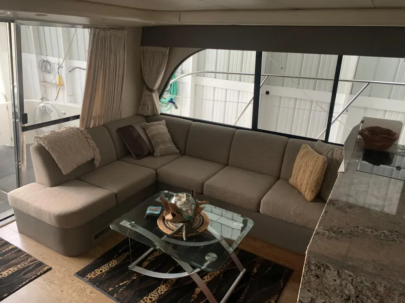 Slide: The Image of Engine room of a 1997 Bayliner Pilothouse boat, showcasing mechanical components and wiring. - 29