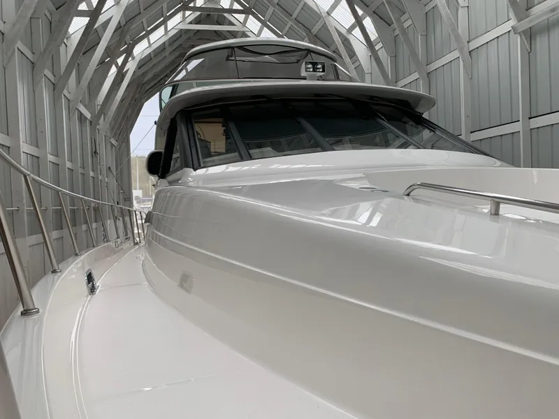 Slide: The Image of Luxurious interior of 1997 Bayliner 5788 Pilot House Motoryacht with modern furnishings. - 3