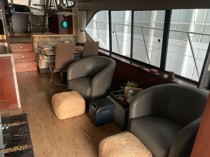 Slide: The Image of Engine room of a 1997 Bayliner Pilothouse boat, showcasing a large marine engine. - 30