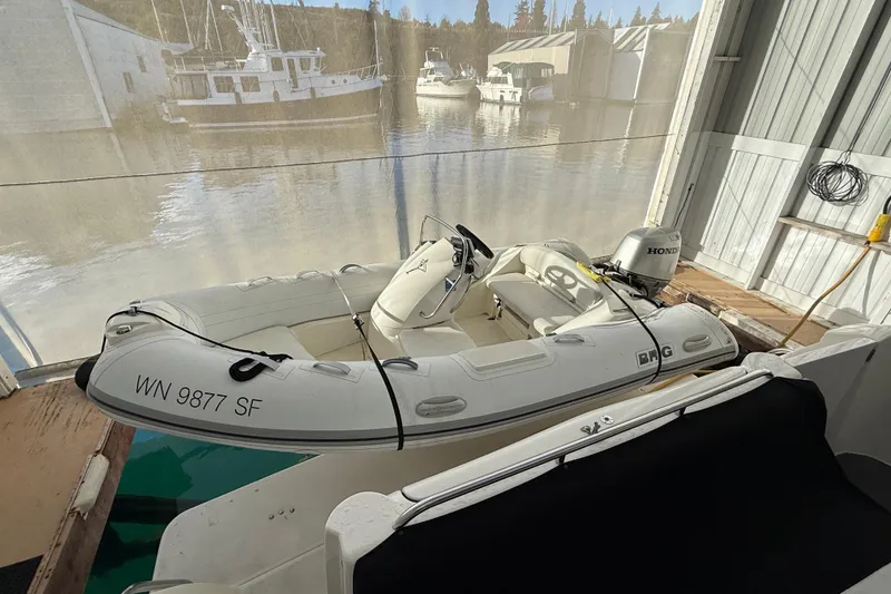 Slide: The Image of 1997 Bayliner 5788 Pilot House Motoryacht with glass door and interior view. - 36