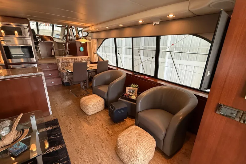 Slide: The Image of Luxurious interior of a 1997 Bayliner 5788 Pilot House Motoryacht with modern furnishings. - 37