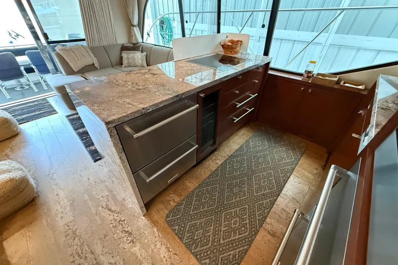 Slide: The Image of Luxurious interior of 1997 Bayliner 5788 Pilot House Motoryacht with modern furnishings. - 39