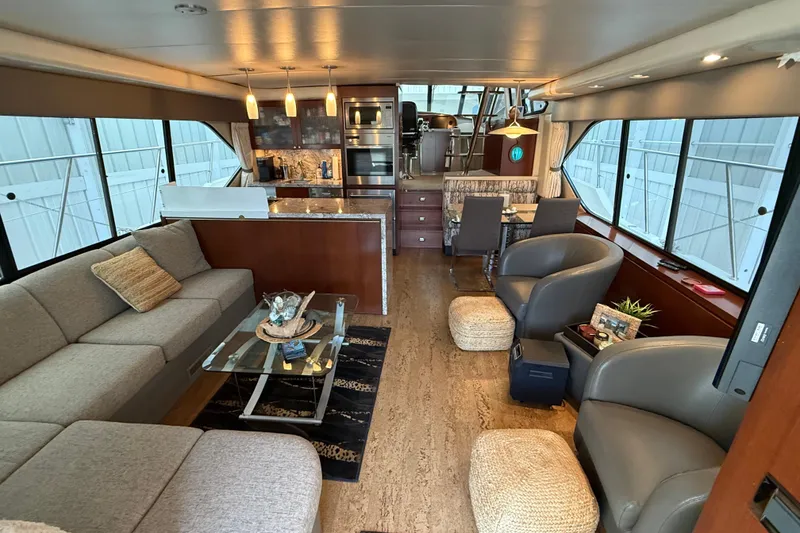 Slide: The Image of Luxurious interior of 1997 Bayliner 5788 Pilot House Motoryacht with elegant dining area. - 41