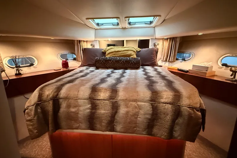 Slide: The Image of Interior of 1997 Bayliner 5788 Pilot House Motoryacht with dining area and spiral staircase. - 45