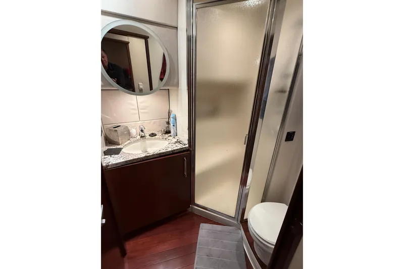 Slide: The Image of Luxurious bedroom interior of 1997 Bayliner 5788 Pilot House Motoryacht with elegant bedding and decor. - 46