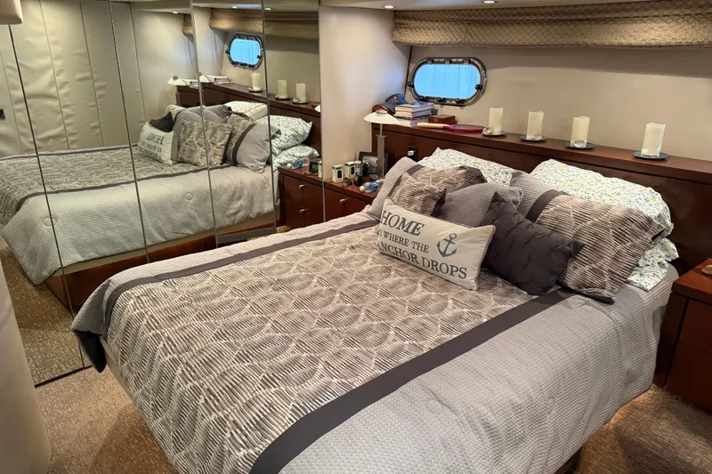 Slide: The Image of Cozy bedroom in 1997 Bayliner 5788 Pilot House Motoryacht with nautical decor. - 47
