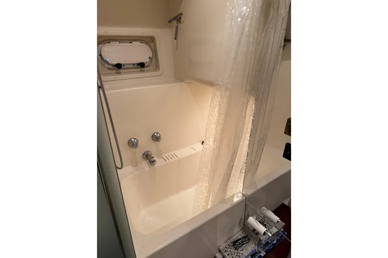 Slide: The Image of Luxurious interior of 1997 Bayliner 5788 Pilot House Motoryacht with elegant cabinetry and decor. - 48