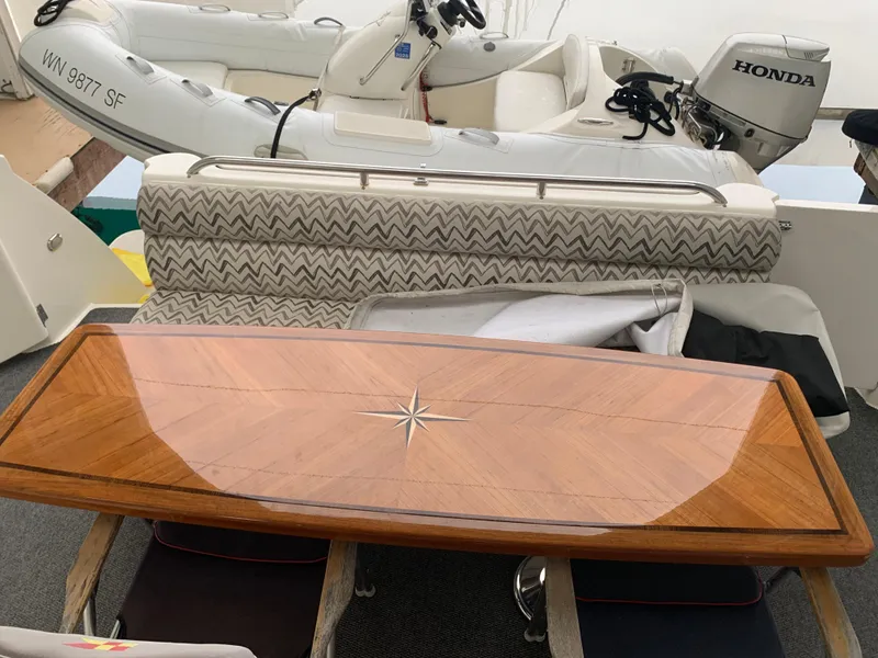 Slide: The Image of 1997 Bayliner Pilothouse boat in a covered dock, side view. - 9