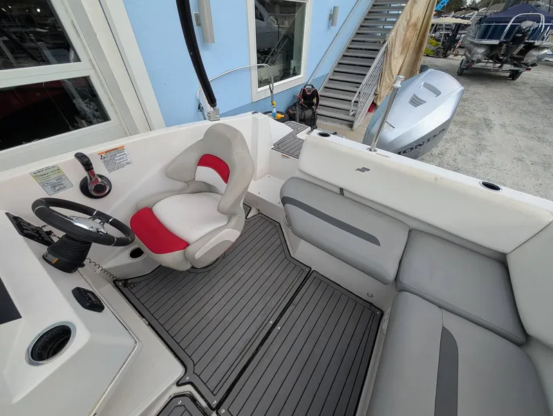 Slide: The Image of 2020 Starcraft SVX 171 boat interior with steering wheel and seating. - 11