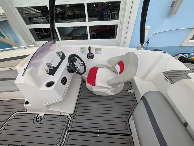 Slide: The Image of 2020 Starcraft SVX 171 boat interior with steering wheel and seating. - 12